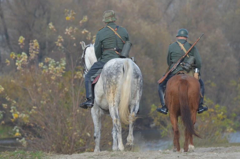 A re-enactment in Kiev, Ukraine of the WWII liberation of Kiev from the Nazis. Two riders are wearing German uniforms.